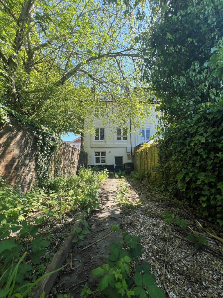 Lot: 61 - END-TERRACE CITY CENTRE PROPERTY FOR IMPROVEMENT - Rear view of property and garden